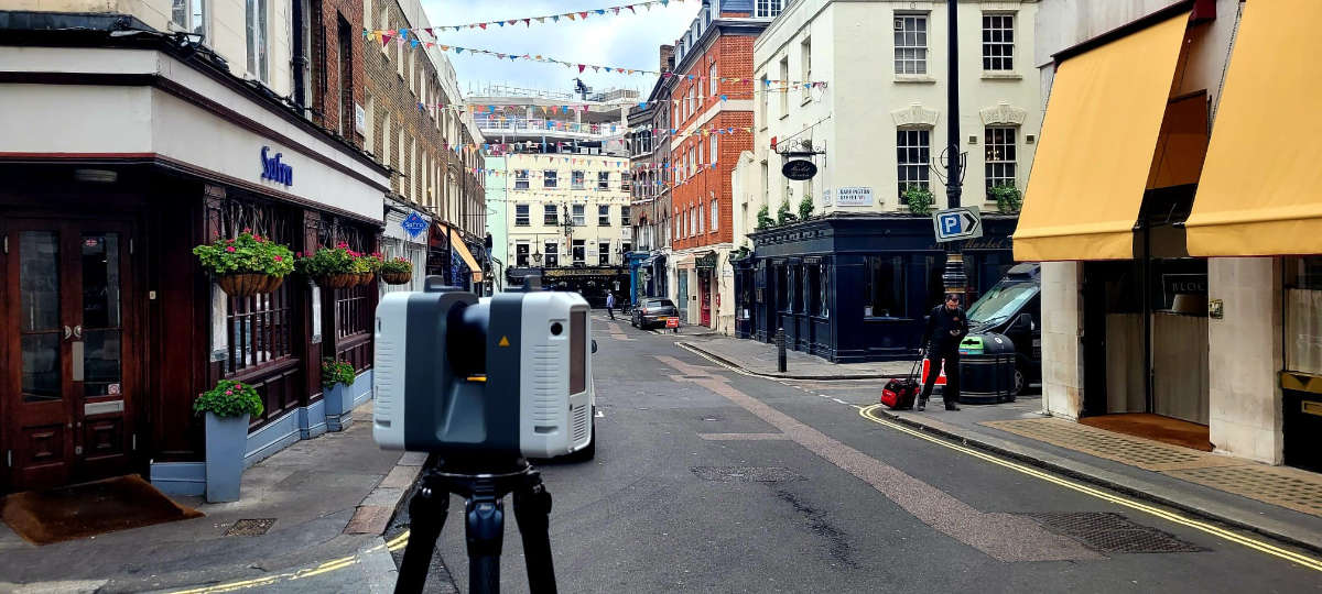 Alex - Scanner in forefront of strett of restaurants in London