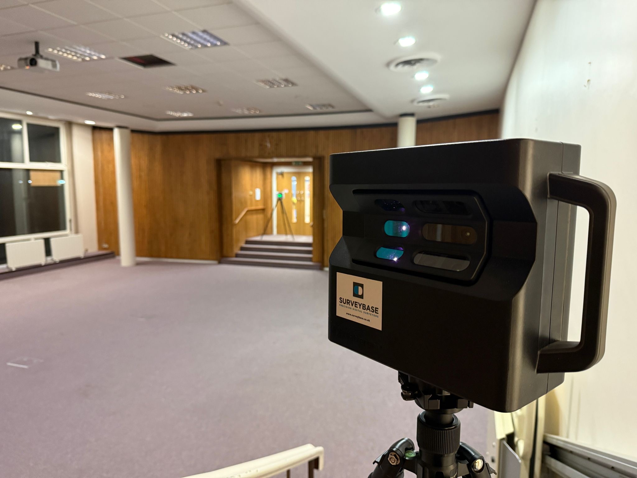Matterport camera set up in an office room to capture a 360-degree digital survey for virtual walkthroughs