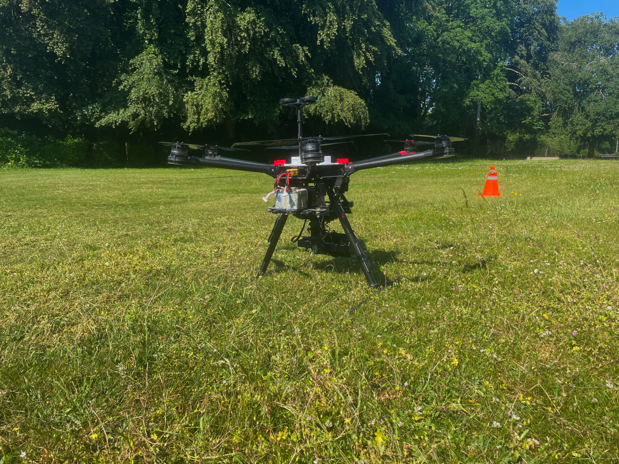 Drone survey drone positioned on the ground in a field for aerial data collection